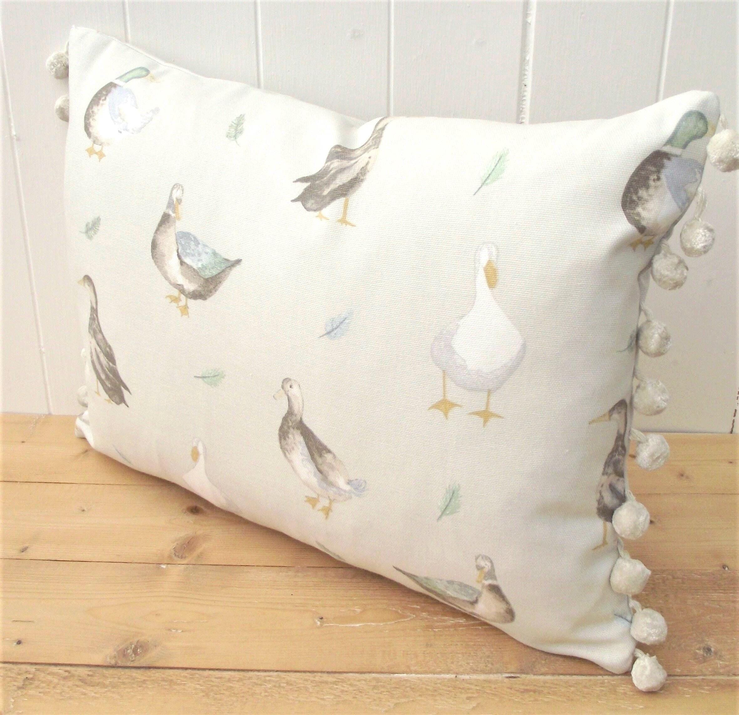 Jenny Duck Cushion with Pom Poms, Ducks Pattern on both side with a zip fastening.