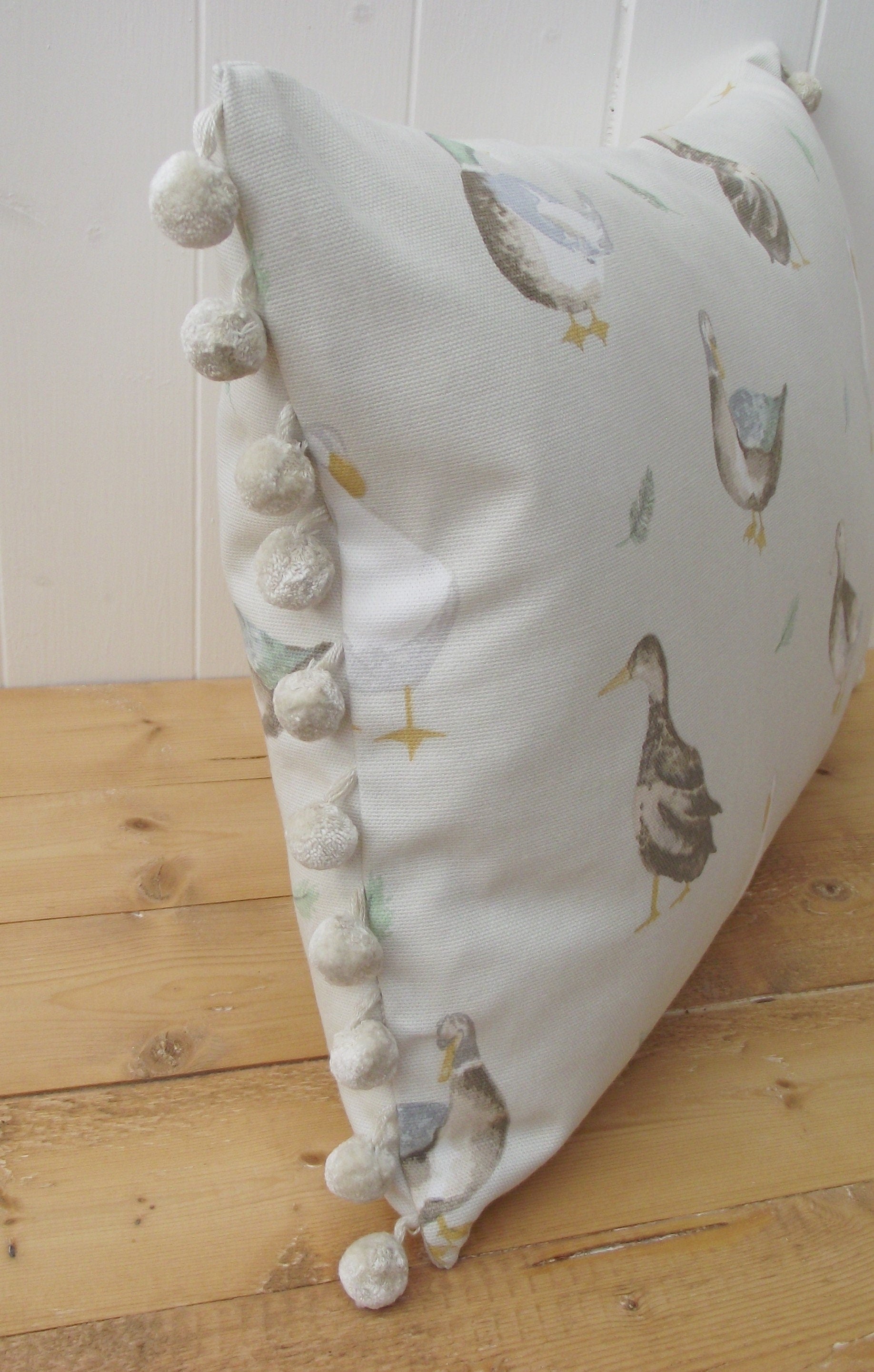 Jenny Duck Cushion with Pom Poms, Ducks Pattern on both side with a zip fastening.