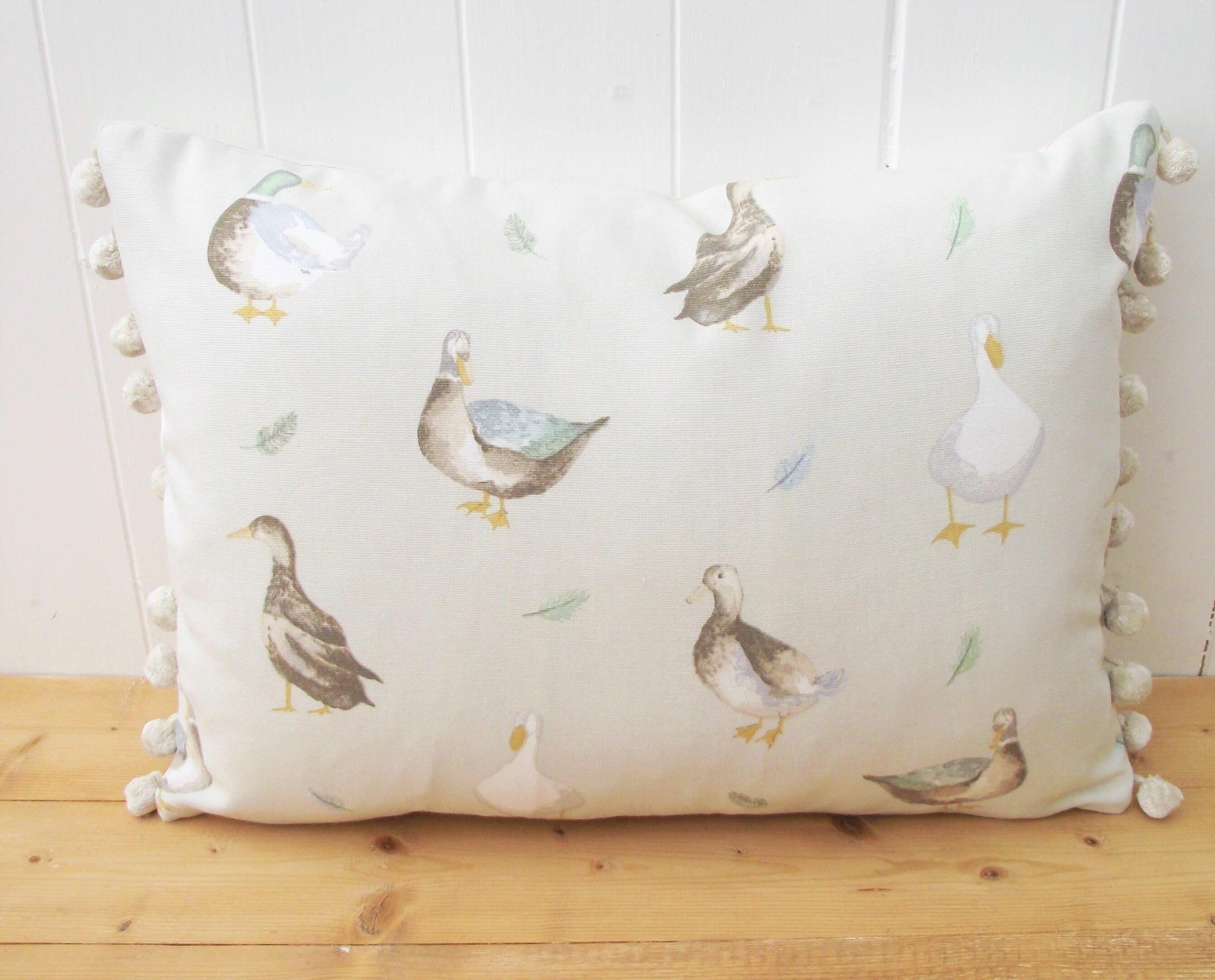 Jenny Duck Cushion with Pom Poms, Ducks Pattern on both side with a zip fastening.