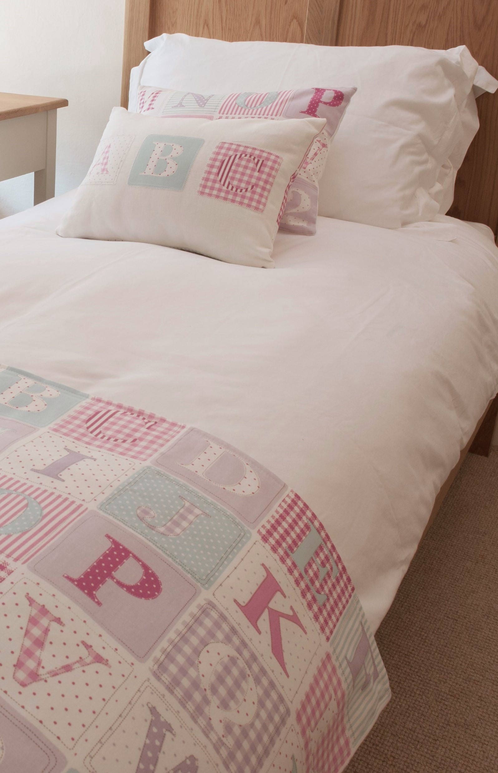 Fryetts Pink Alphabet Cushion: Handmade Nursery Decor
