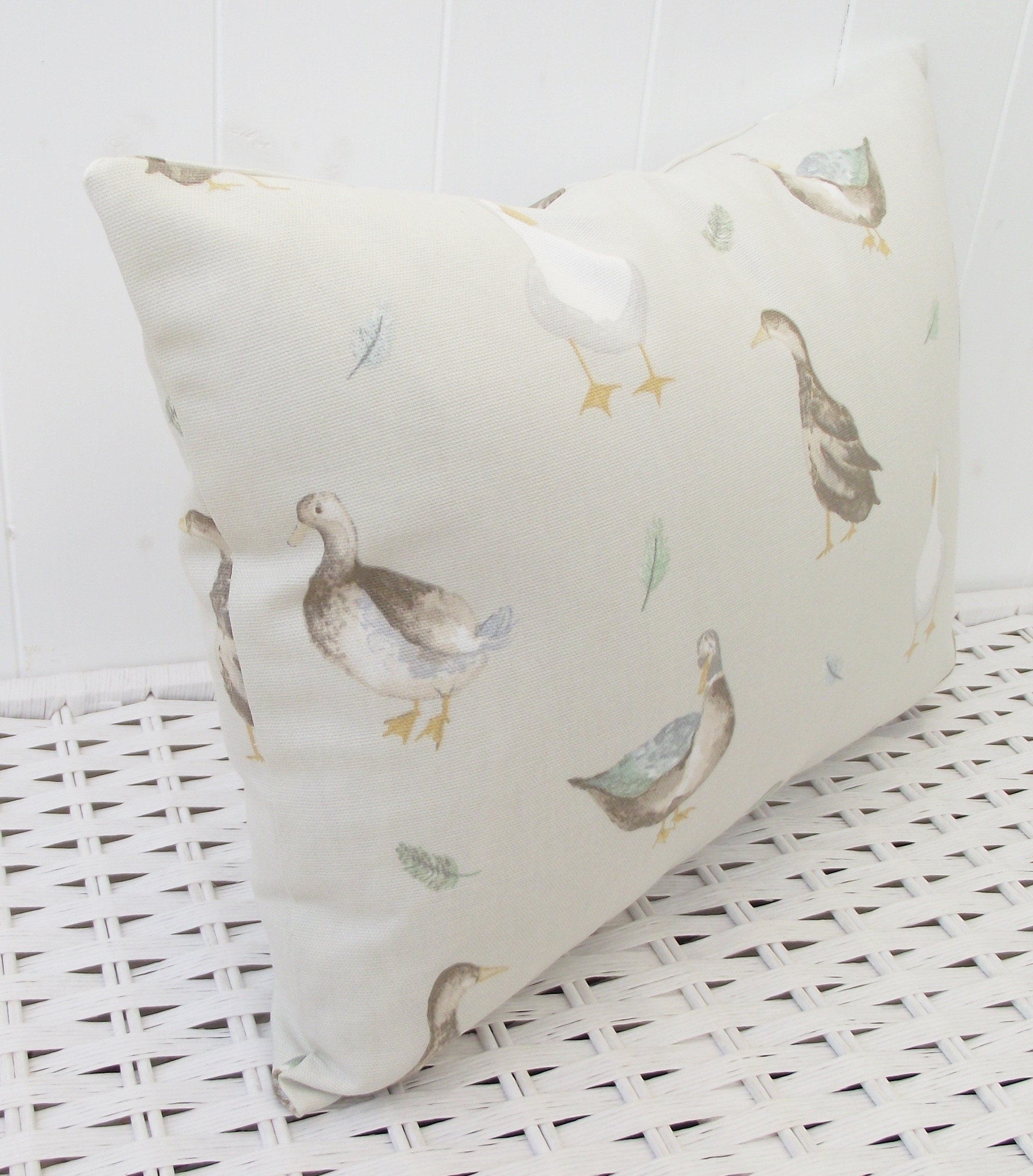 Jenny Duck Cushion with Pom Poms, Ducks Pattern on both side with a zip fastening.